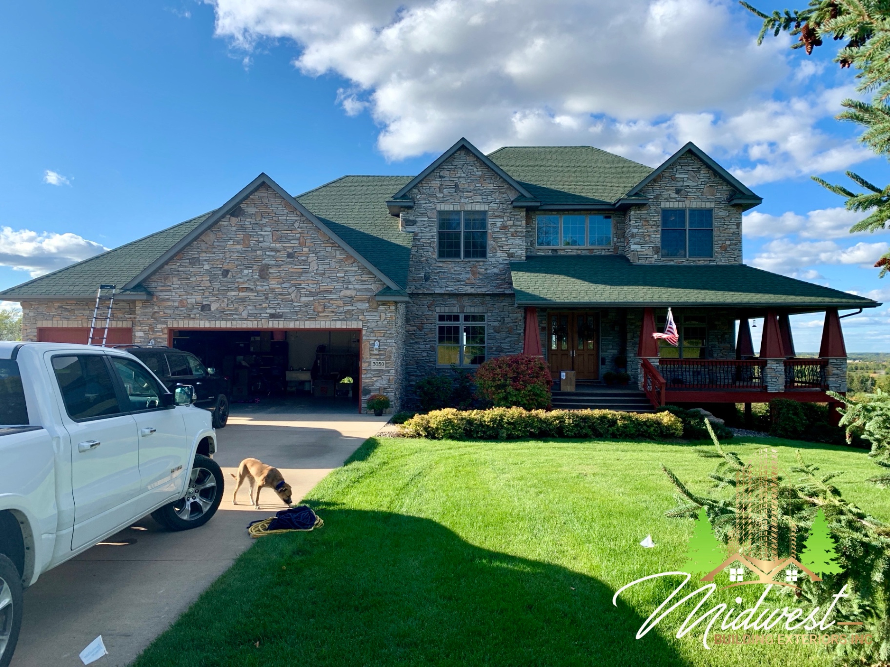 Green stone-coat architectural shingle roof on a craftsman-style home near Minnetonka Mills, MN